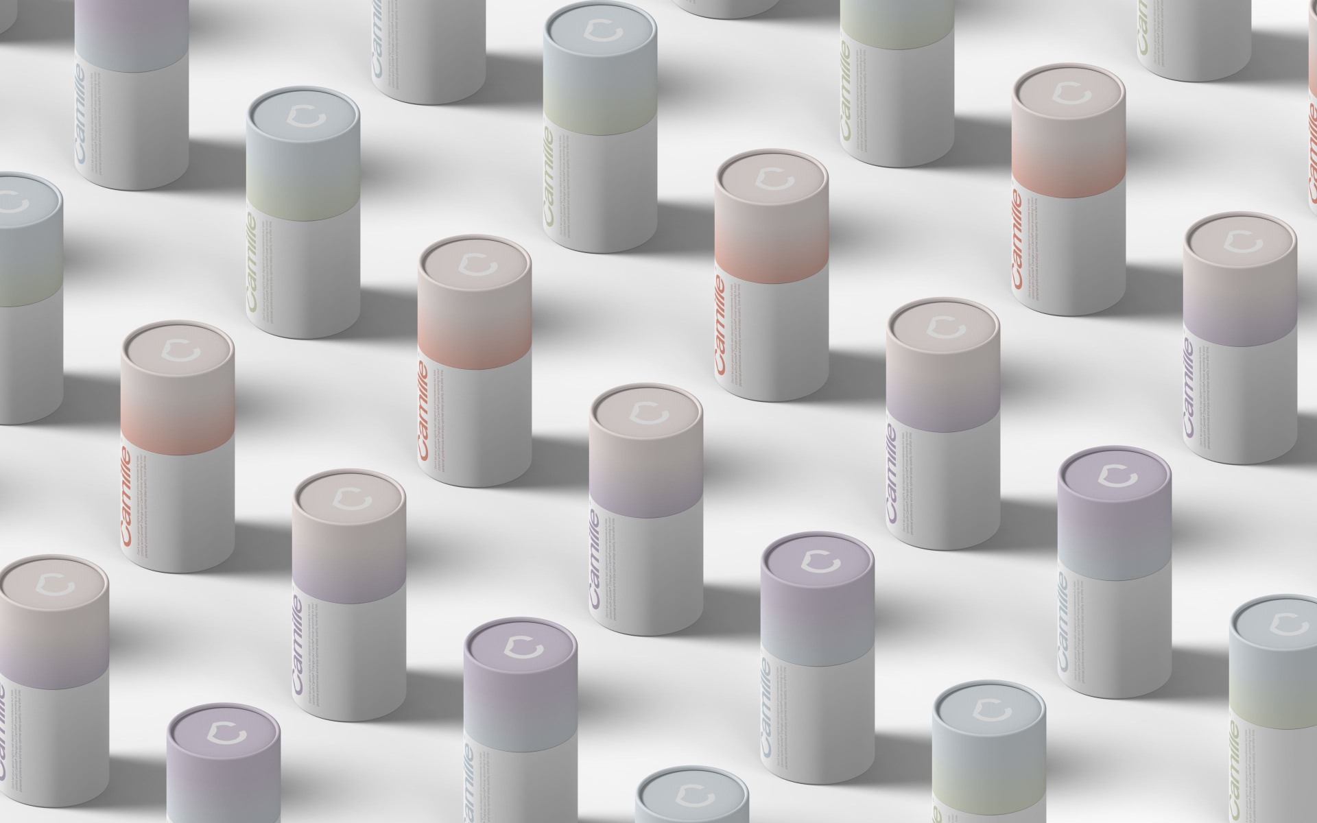 Une grille de boîtes cylindriques pastel, représentant la gamme Camille de couvre-matelas interchangeables. 