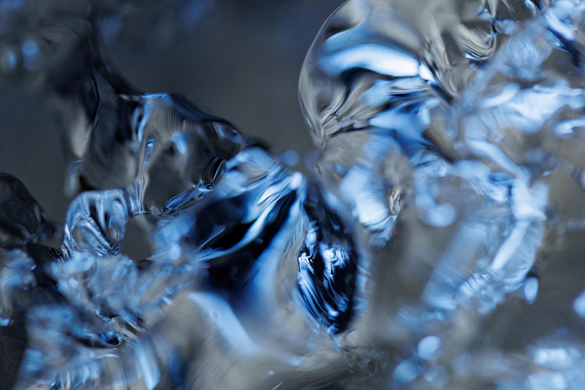 a close-up of abstract, translucent blue shapes resembling ice and giving a refreshing feeling