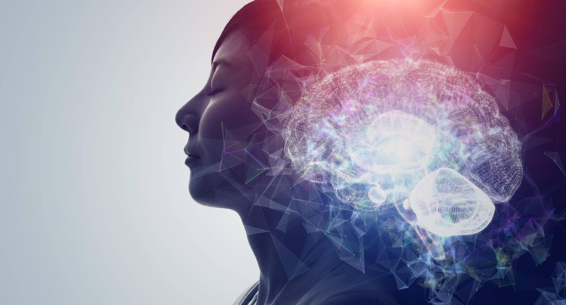 An abstract image of a lady with her eyes closed, surrounded by sparks of light radiating from her head to face. 