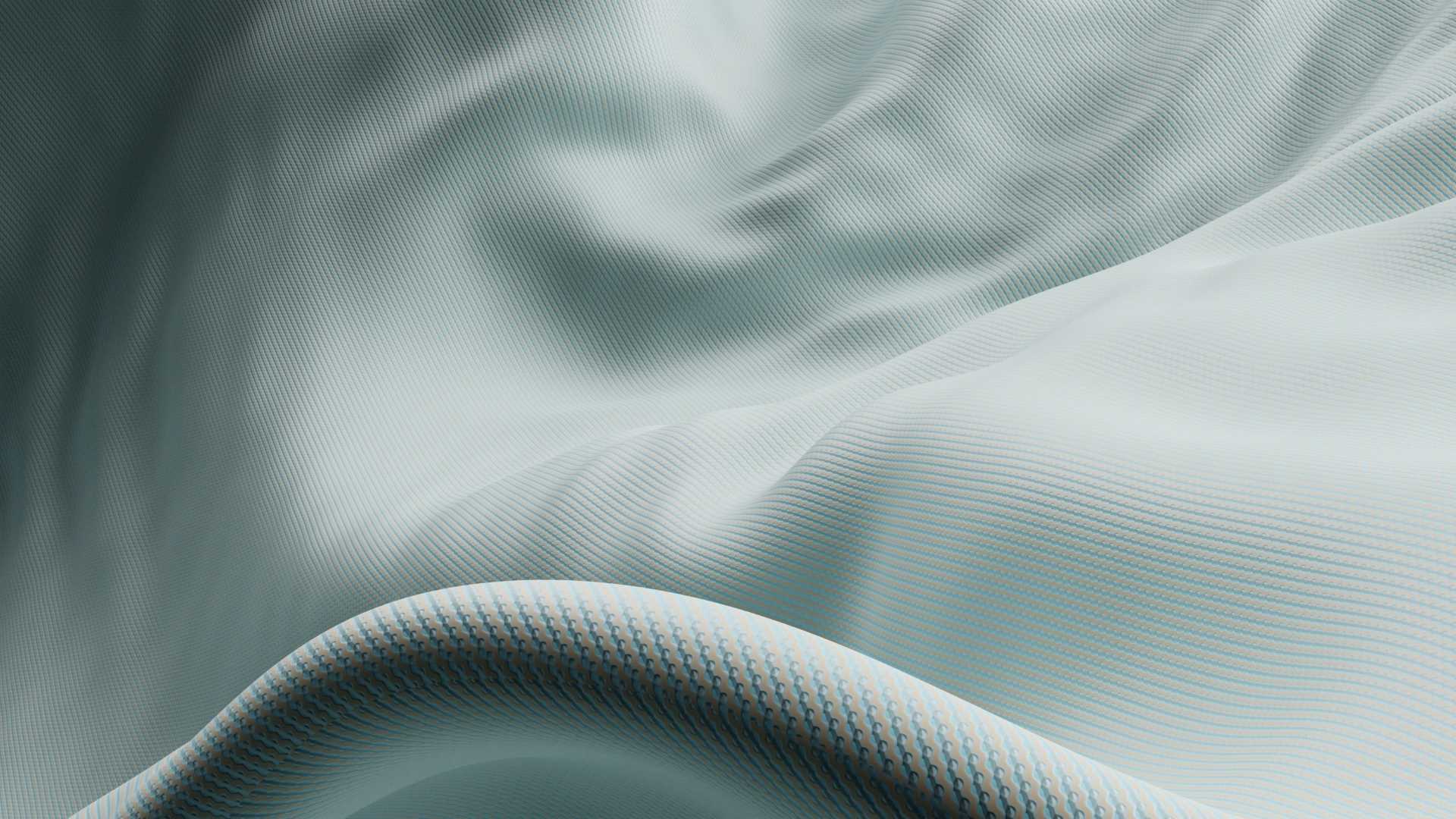 Primer plano de una pieza textil azul claro, texturizada y ondulada, apta para un colchón infantil, proporcionando sensación de espacio y transpirabilidad