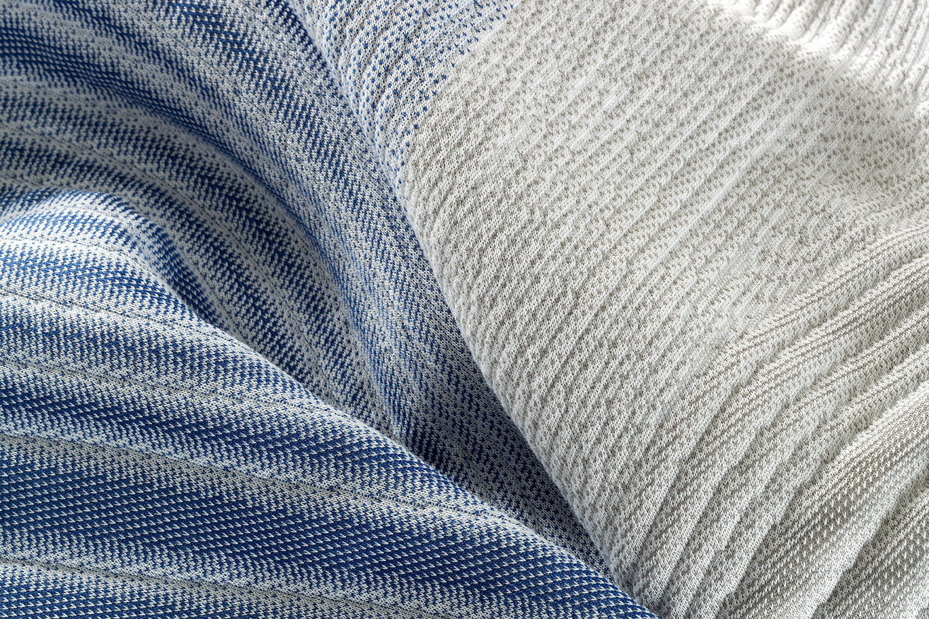 High-quality grey fabric with a subtle strip of light blue and grey, featuring a smooth texture and elegant weave 
