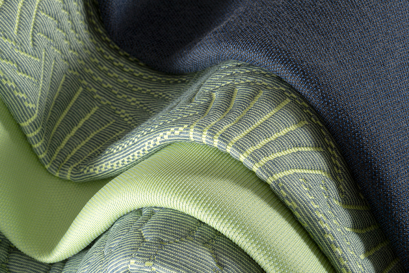 Close-up of a blanket  AI-generated content may be incorrect.A seamless blend of pistachio, olive, and navy blue textiles, offering a refined and balanced color combination.  