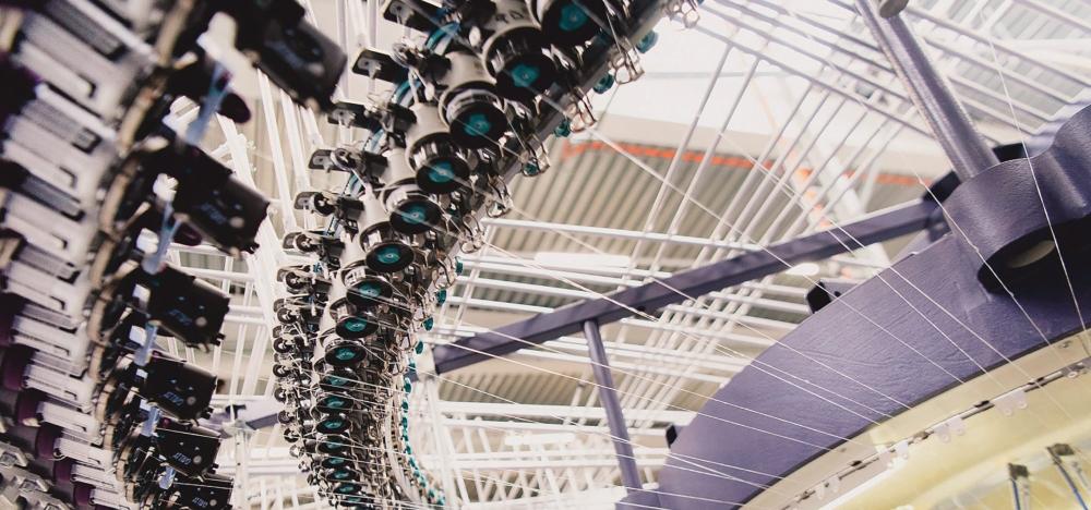 Modern textile knitting machine used in the production of mattress fabrics.